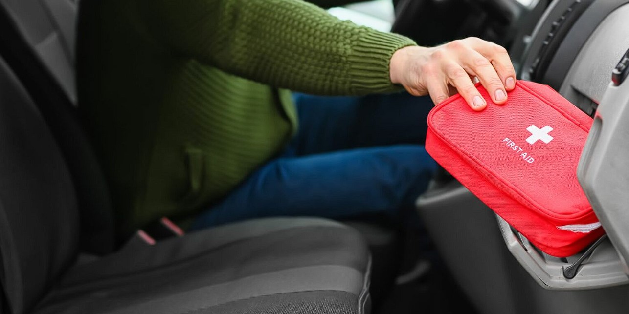 What should be included in a car first aid kit
