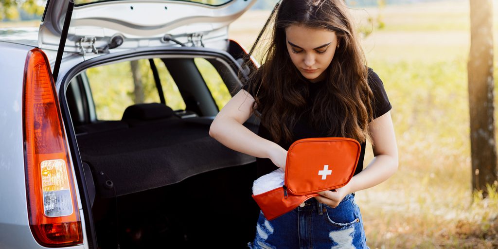 What should a car first aid kit contain?